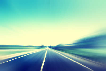 Empty asphalt road in motion blur. Vintage style.の写真素材