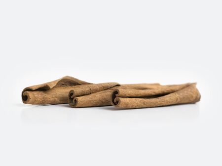 Several cinnamon sticks isolated on grey background.の写真素材