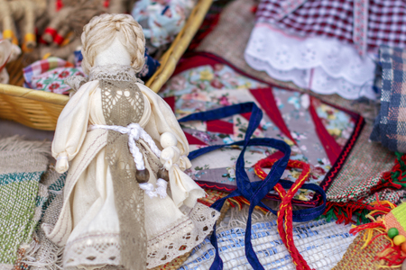 handmade folk doll made of cloth without a face in a beautiful dress.の写真素材