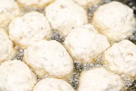 Tasty, fragrant healthy cutlets of chicken meat with spices are fried in a pan in oil