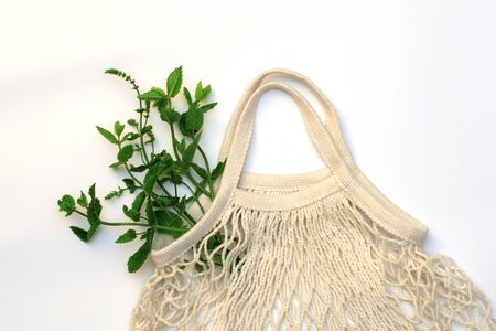 Raw, juicy, fresh vegetables in a natural cotton string bag. Zero waste. Cotton.Vegetarianism.
