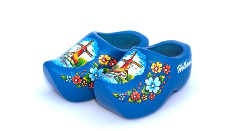 Traditional dutch wooden shoes made of wood on white background
