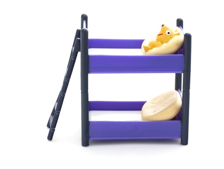 Doll bunk bed with stairs and pillows on a white background