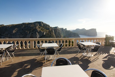 Tables of cafe at sunset on Cap de Formentor - beautiful coast of Majorca, Spain - Europeの写真素材