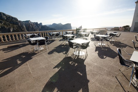 Tables of cafe at sunset on Cap de Formentor - beautiful coast of Majorca, Spain - Europe