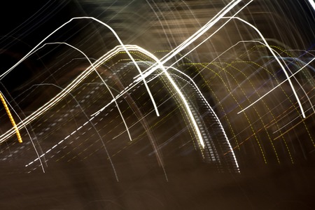 Abstract blurred colorful light effect on a black background. Long exposure photo of moving camera.