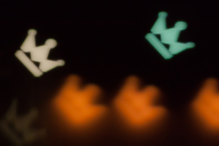 Blurred photo of defocused bokeh colorful lights in the shape of crown.の写真素材