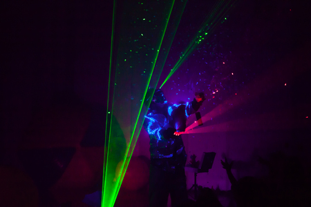 Colorful lights show. Laser show in motion in dark.の写真素材