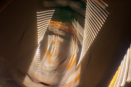 Abstract blurred light effect on a black background. Long exposure photo of moving camera.の写真素材