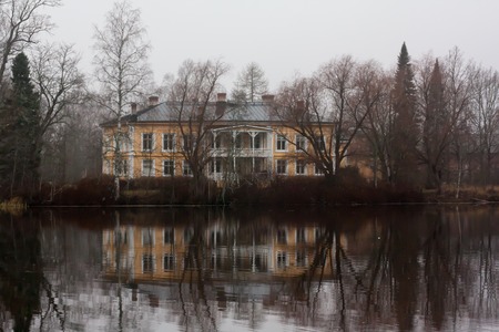 KOUVOLA, FINLAND - OCTOBER 18, 2018: Beautiful wooden Rabbelugn Manor - Takamaan Kartano. Wrede family house was built in 1820 on the river Kymijoki bank.のeditorial素材