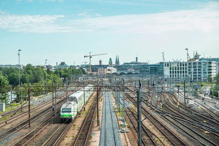 Helsinki,Finland - June 12, 2019: Wiew of Helsinki railway station. Train departs the stationのeditorial素材