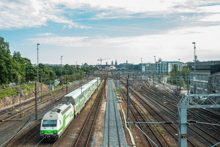 Helsinki,Finland - June 12, 2019: Wiew of Helsinki railway station. Train departs the stationのeditorial素材