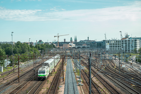 Helsinki,Finland - June 12, 2019: Wiew of Helsinki railway station. Train departs the stationのeditorial素材