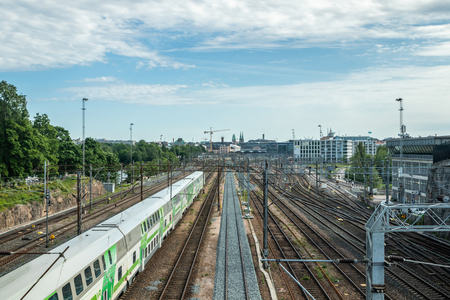 Helsinki,Finland - June 12, 2019: Wiew of Helsinki railway station. Train departs the stationのeditorial素材
