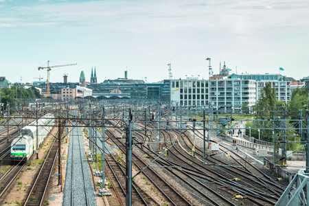 Helsinki,Finland - June 12, 2019: Wiew of Helsinki railway station. Train departs the stationのeditorial素材