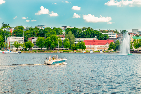 Lappeenranta, Finland - June 20, 2019: Summer landscape with fountain and boats in Lappeenranta harbor on Saimaa lake.のeditorial素材