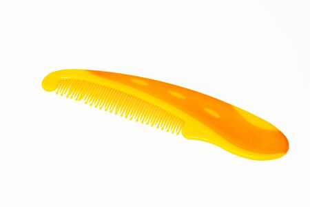Orange color comb isolated on white background