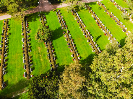 Hollola, Finland - 9 September 2019: Aerial view of cemetery on the yard of old medieval stone church of St. Mary in Hollola, Finlandのeditorial素材