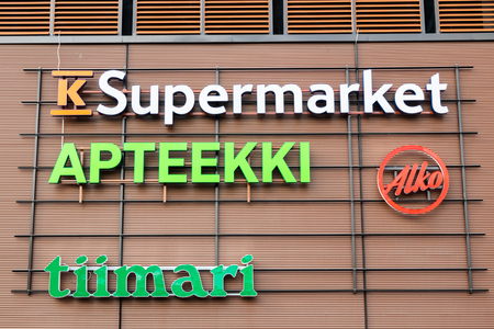 Kouvola, Finland - 22 September, 2019: Close-up of the signs of Finnish K-Supermarket, Pharmacy, Tiimari and Alko.のeditorial素材