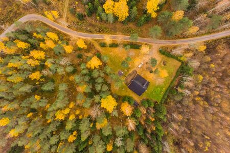 Aerial view of lake and colorful forests on a autumn day in Finland. Drone photographyの写真素材