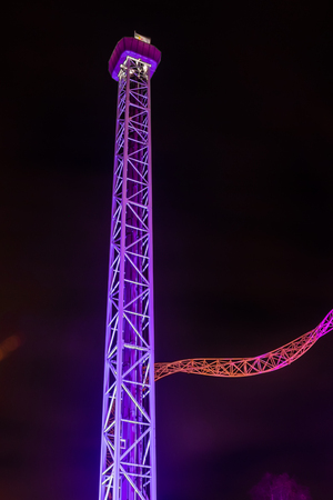 Helsinki, Finland - 19 October 2019: The Carnival of Light event at the Linnanmaki amusement park. Ride Raketti in night illumination.のeditorial素材