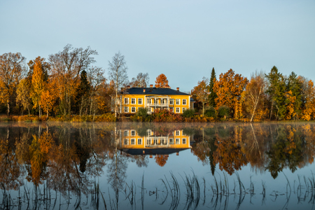 Kouvola, Finland - 15 October 2019: Autumn landscape with beautiful wooden Rabbelugn Manor - Takamaan Kartano. Wrede family house was built in 1820 on the river Kymijoki bank.のeditorial素材