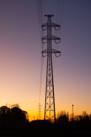 Landscape with power line on beautiful sunset background.の写真素材