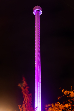 Helsinki, Finland - 19 October 2019: The Carnival of Light event at the Linnanmaki amusement park. Ride Raketti in night illumination.のeditorial素材