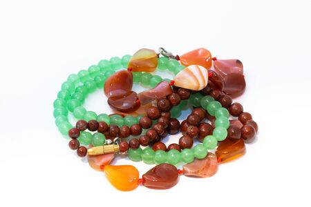 Jasper, agate and nephritis beads isolated on white backgroundの写真素材
