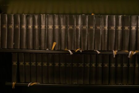 Porvoo, Finland - 2 October 2019: Closeup of a row of green hymn books on finnish language in Porvoo...
