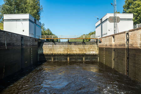 Lappeenranta, Finland - August 7, 2019: Lock on the Saimaa Canal at Malkia. View from water.のeditorial素材