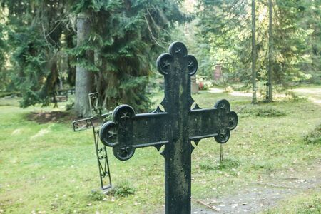 Cross at old beautiful semetery in Finlandの写真素材