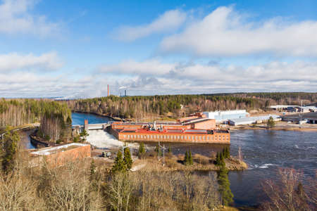 Aerial view of hydroelectric power generation plant and Ankkapurha Industrial Museum at Kymijoki river, Finland.のeditorial素材