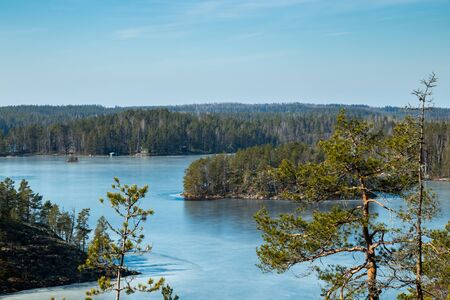 Beautiful landscape with icy lake in the national park Repovesi, Finlandの写真素材