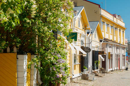 Porvoo, Finland - June 3, 2020: Beautiful street with shops and blooming flowers in old town of Porvooのeditorial素材