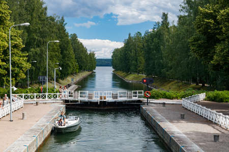 Asikkala, Finland - 16 July 2020: Vaaksy Canal between two big lakes Vesijarvi and Paijanne. Gateway is open for boats going though.のeditorial素材
