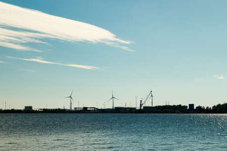 Windmills on island Mussalo in Baltic Sea at sunset, Kotka, Finlandの写真素材