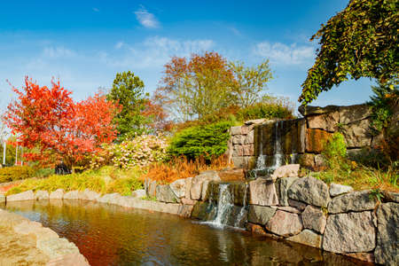 Beautiful waterfall in autumn park, Kotka, Finlandの写真素材