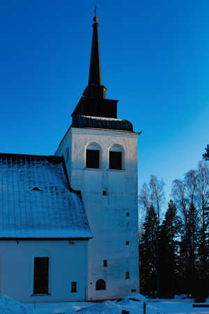Beautiful white church of Valkeala in winter sunset, Kouvola, Finlandの写真素材