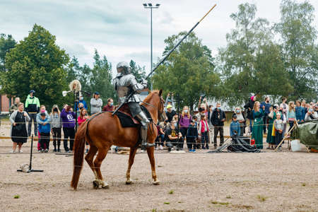 Kouvola, Finland - 7 August 2021: Outdoor performance at the Medieval Market Festival. Knights on horseback.のeditorial素材