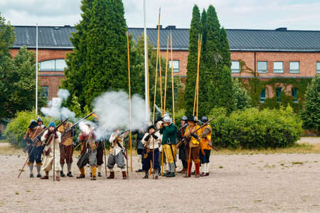 Kouvola, Finland - 7 August 2021: Outdoor performance at the Medieval Market Festival. Soldiers of the 17th century.のeditorial素材
