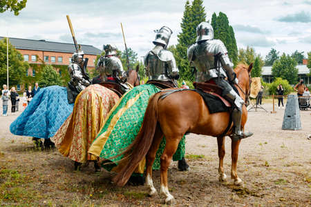 Kouvola, Finland - 7 August 2021: Outdoor performance at the Medieval Market Festival. Knights on horseback.のeditorial素材
