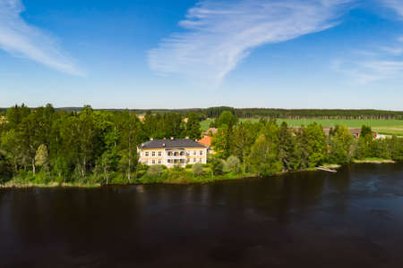 Kouvola, Finland - June 3, 2021: Aerial view of beautiful wooden Rabbelugn Manor - Takamaan Kartano. River Kymijoki bank.のeditorial素材