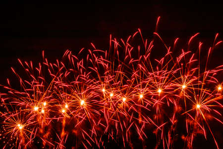 Colorful fireworks lights on the sky background at night