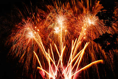 Colorful fireworks lights on the sky background at nightの写真素材