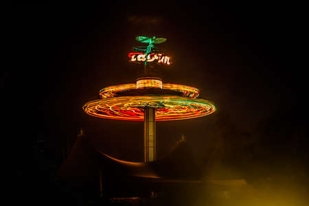 Kouvola, Finland - 28 August 2021: Rotating ride Taifun in amusement park Tykkimaki at nightのeditorial素材