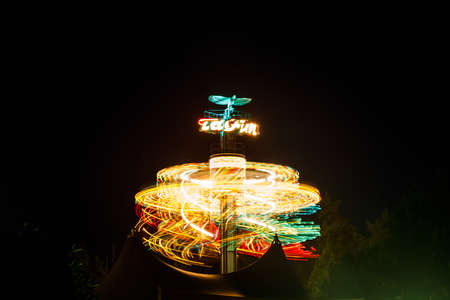 Kouvola, Finland - 28 August 2021: Rotating ride Taifun in amusement park Tykkimaki at nightのeditorial素材
