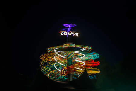 Kouvola, Finland - 28 August 2021: Rotating ride Taifun in amusement park Tykkimaki at nightのeditorial素材