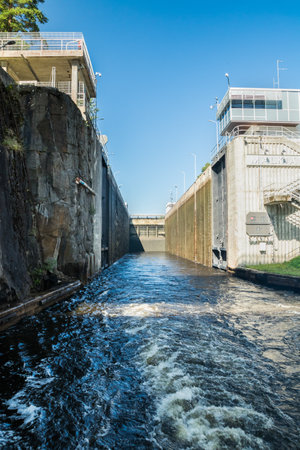 Lappeenranta, Finland - August 7, 2019: Lock on the Saimaa Canal at Malkia. View from water.のeditorial素材
