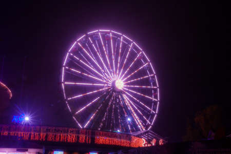 HELSINKI, FINLAND -OCTOBER 12, 2018: The Carnival of Light event at the Linnanmaki amusement park in Helsinki, Finland. Ride Ferris Wheel Rinkeli.のeditorial素材